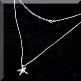 J10. Silver tone necklace with star pendant. 16” - $12 